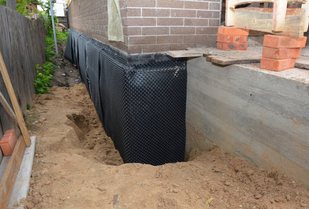 Happy homeowners after waterproofing job in Bettsville